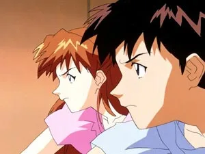 水色とピンクのシャツを着たシンジとアスカが並んでユニゾン訓練を行う第九話公式場面画像