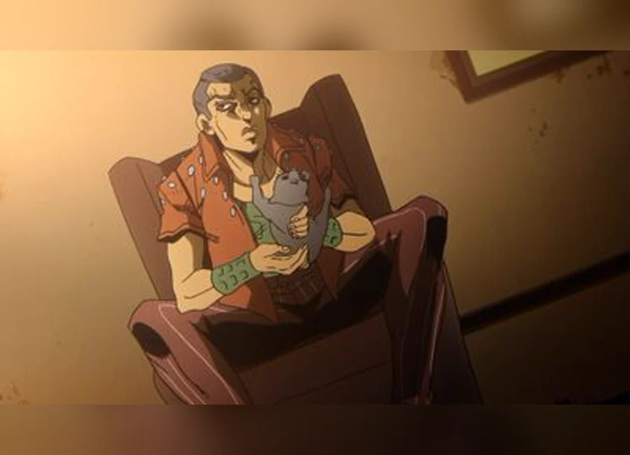 ホルマジオが膝の上で猫を抱える場面